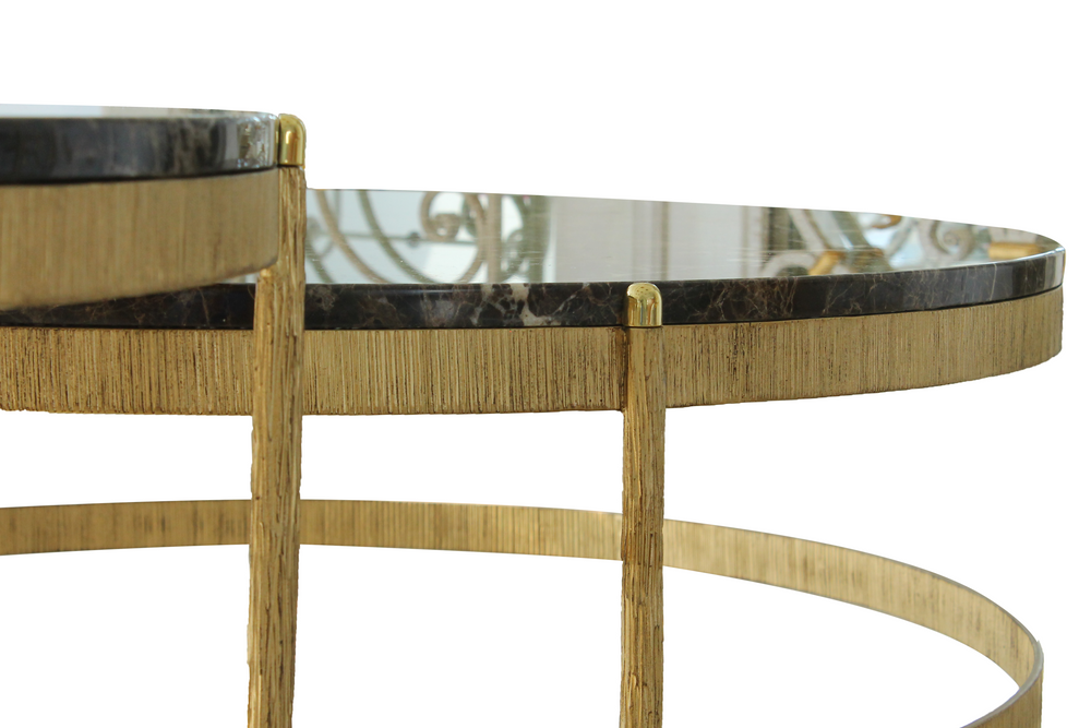 Closeup view of contemporary steel nesting tables with luxurious marble tops, showcasing intricate craftsmanship and elegant design details