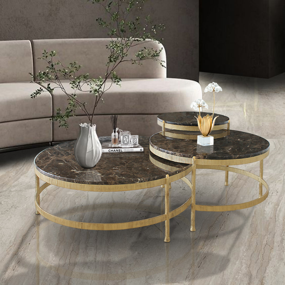Verona nesting tables with Emperador marble, steel frames, and decorative brass detail.