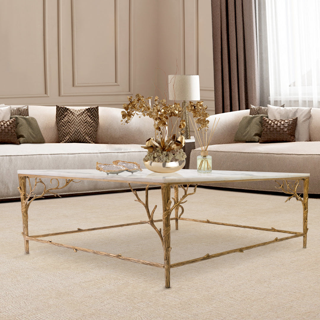 Champagne finish Amalfi center table with marble top and sculpted branch design.