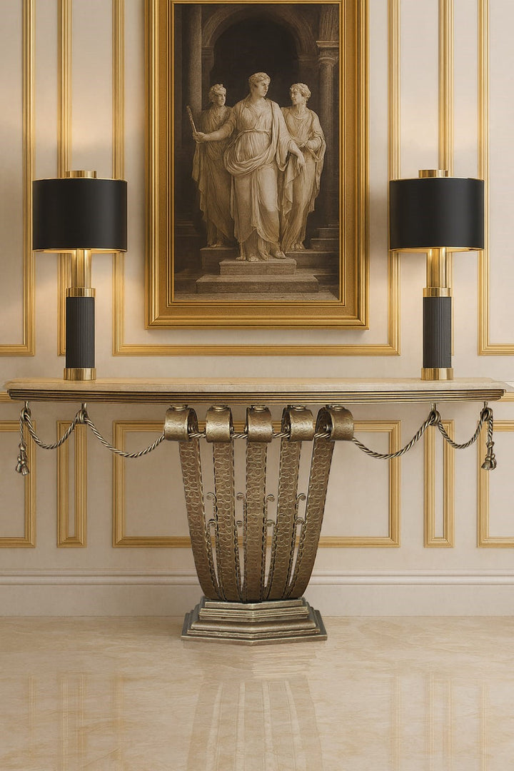 Decorative art deco console table with marble top in a room with gold accents with a classical painting
