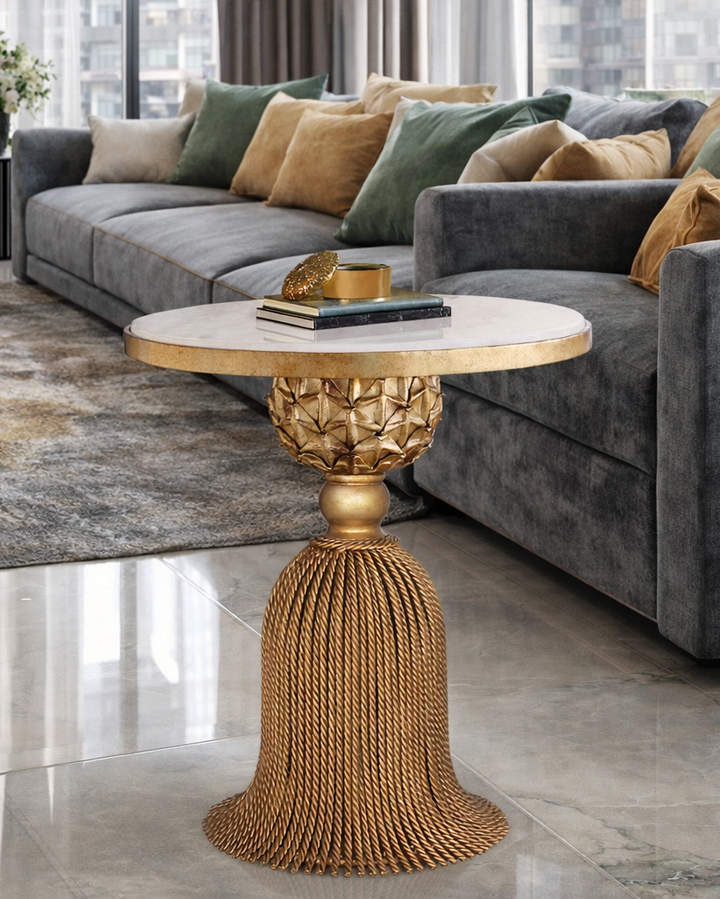 Isadora side table with gold tassel-inspired base and marble top
