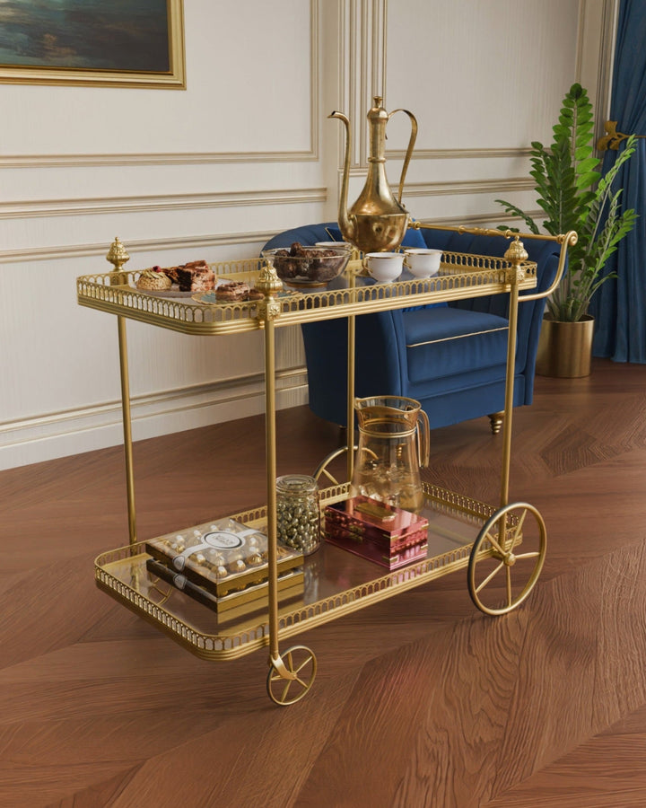 Antique gold Alicia serving trolley with two mirrored glass trays and classic gold wheels