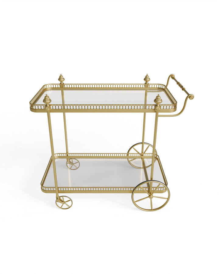 Alicia serving trolley in gold finish with glass trays on a white background