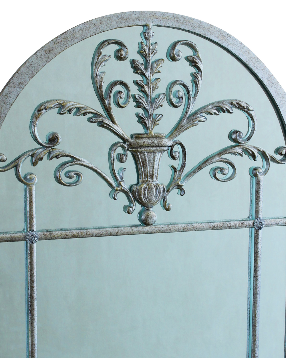 Detailed view of the decorative crest on the Alina arched mirror
