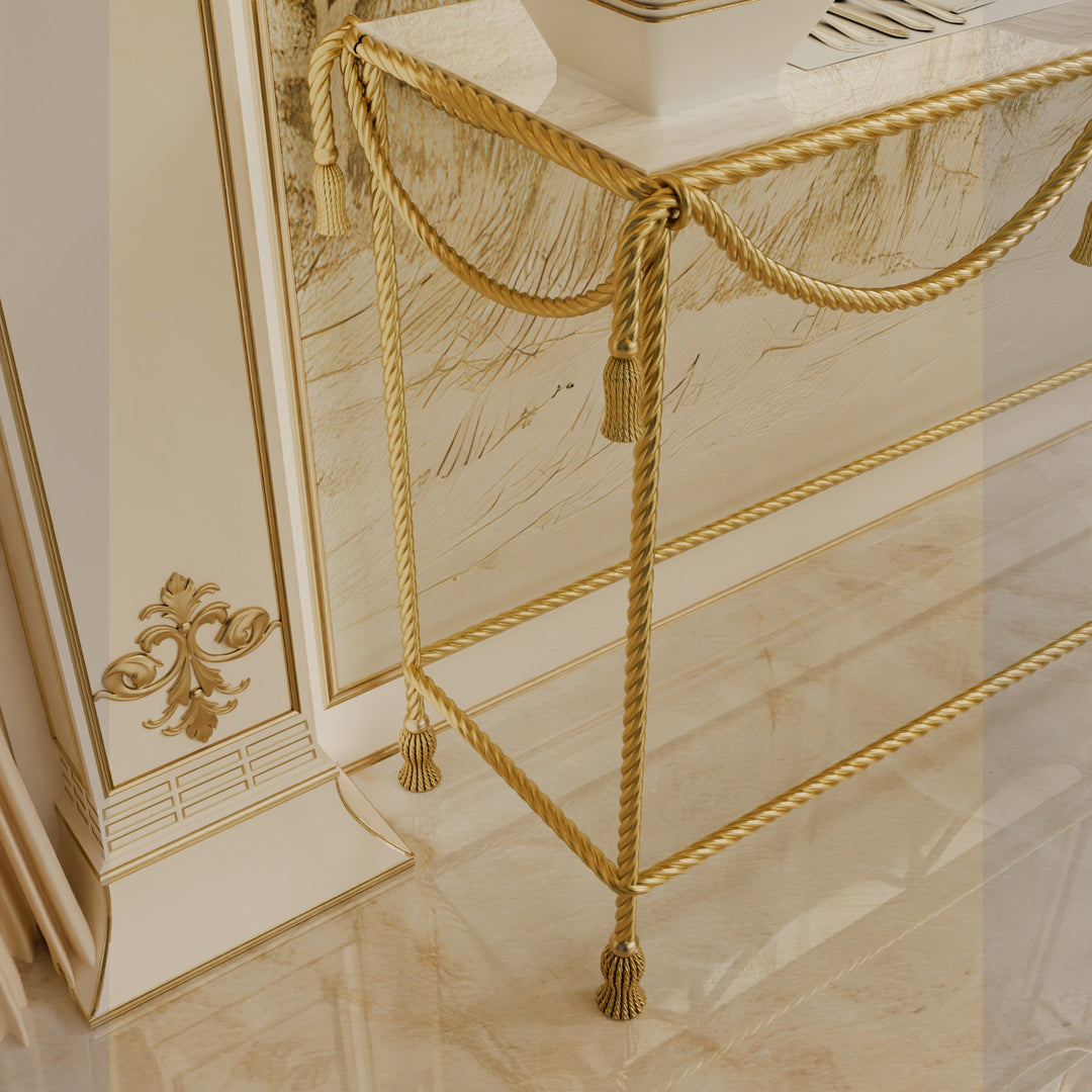 Close-up of the table’s corner showing the gold rope detailing and tassel leg
