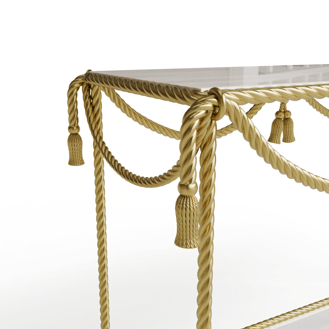 Detailed shot of the twisted gold rope and tassel design on the Allegra Console Table.