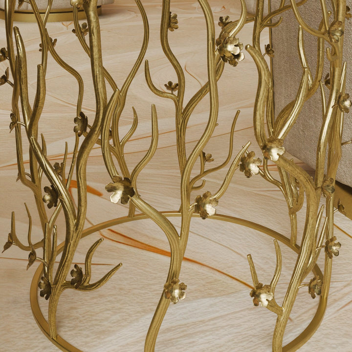 Close-up of sculpted golden branches and delicate flower details on the Blossom side table