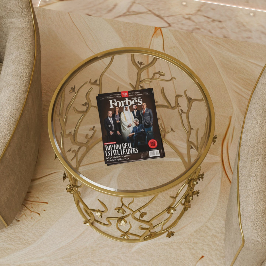 Top-down view of Blossom side table with glass surface and Forbes magazine on display