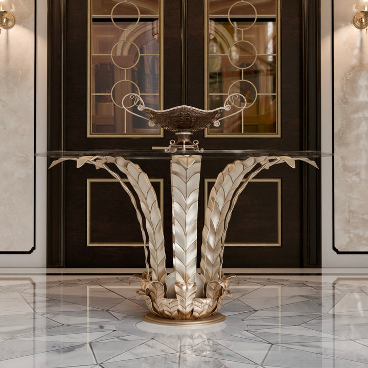 Elegant wrought iron entrance table with intricate leaf details and a clear glass top