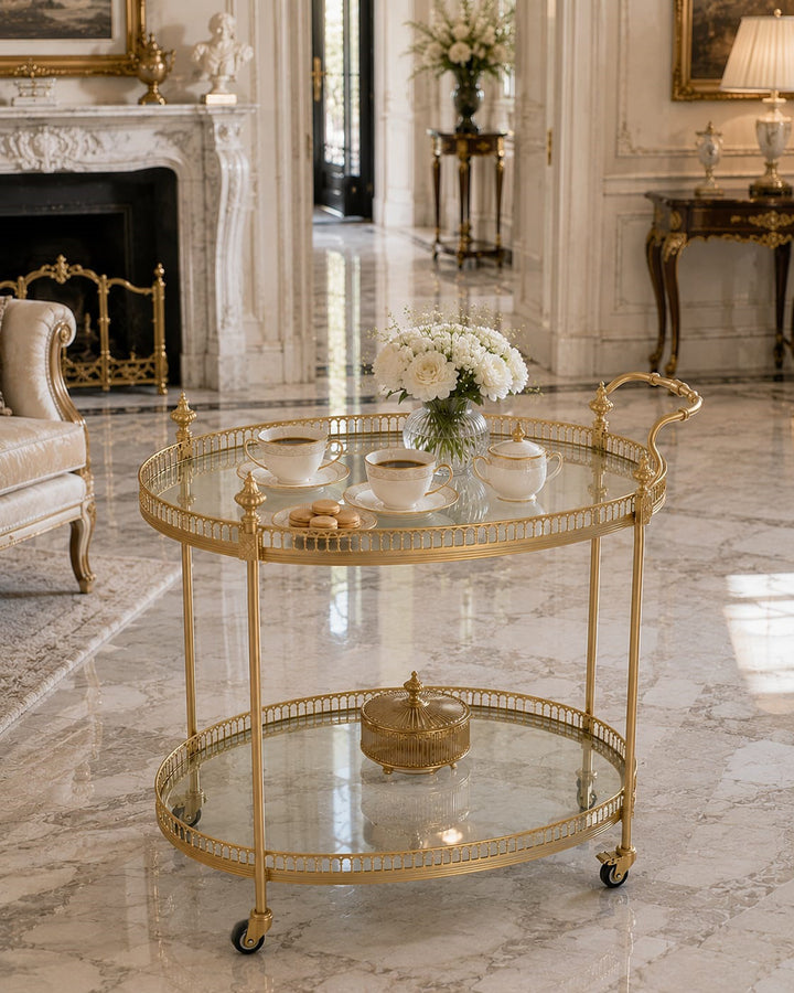 Luxury gold serving trolley with oval glass shelves by Choufani UAE