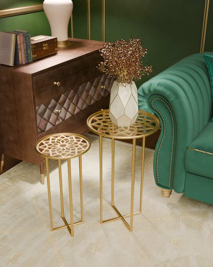 Living room setting with Zara nesting tables, flower vase, emerald sofa, and wooden chest