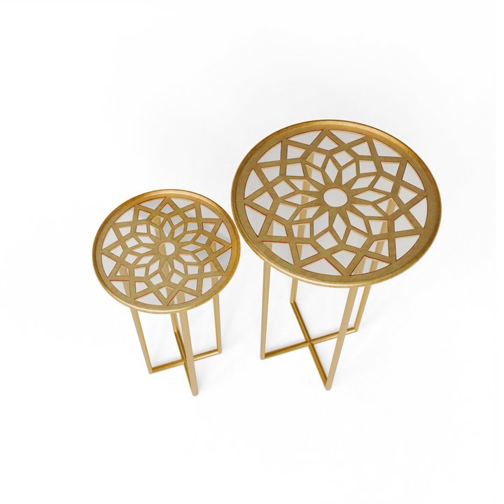 Top angled view of Zara nesting tables showcasing star-patterned metal design beneath glass