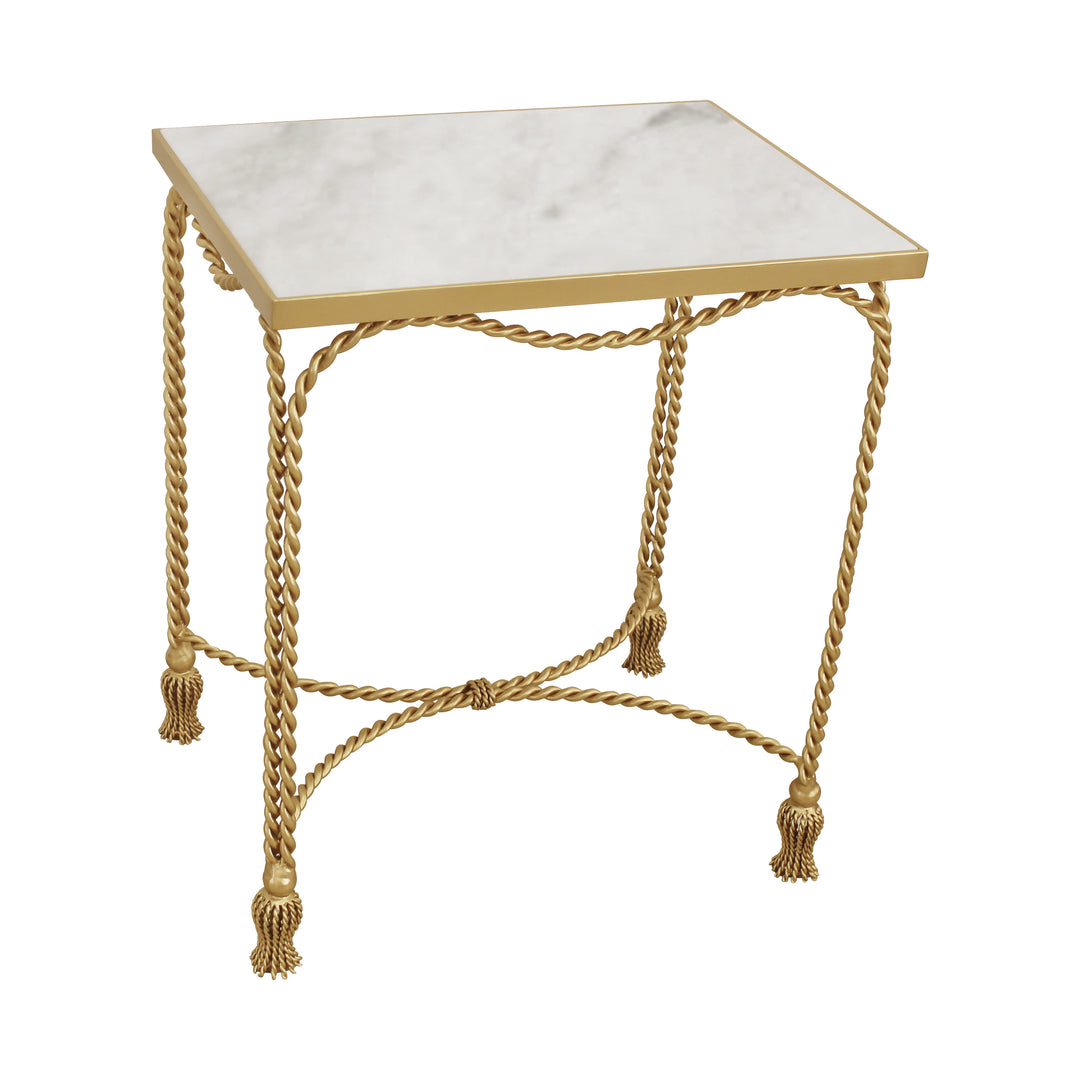 A trendy rectangular side table with golden rope themed metal legs with tassel feet topped with marble