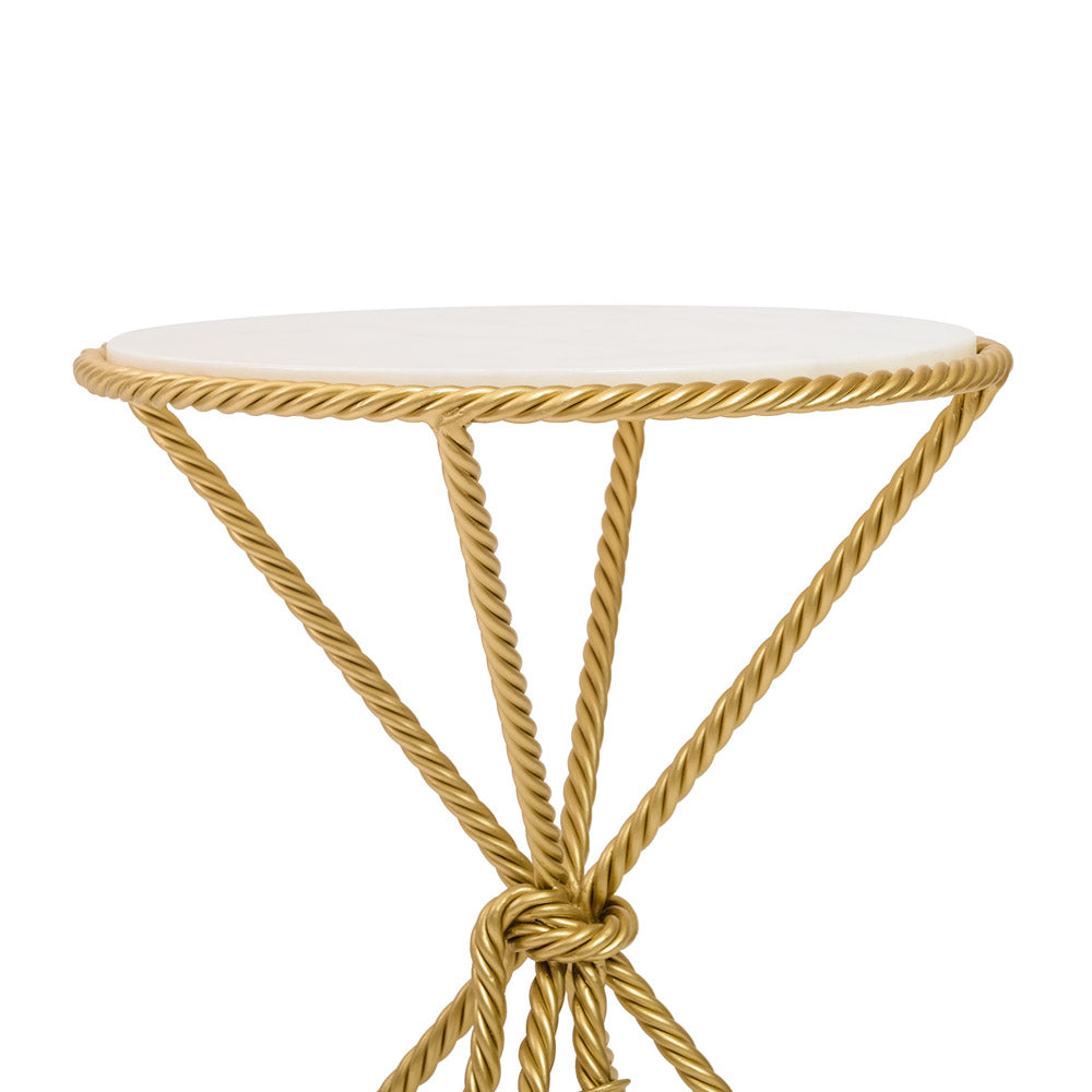 Top portion of a rope themed round table in golden color and marble top