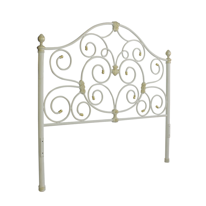 Handmade metal headboard for a single bed with scrolls and classical motifs, painted in white and gold