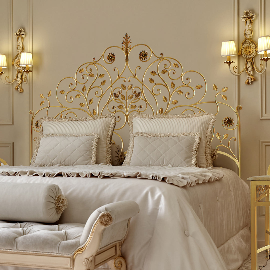 A luxurious wrought iron double bed inspired by nature; with branches, leaves and flowers painted in an antique gold finish