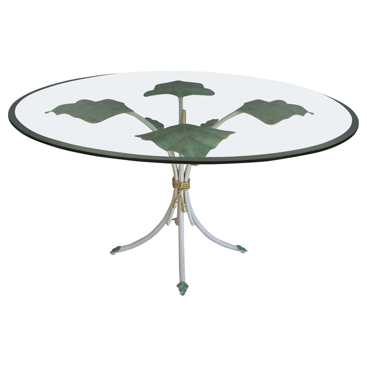 A unique round foyer table with a nature inspired metal forged base, topped with clear glass