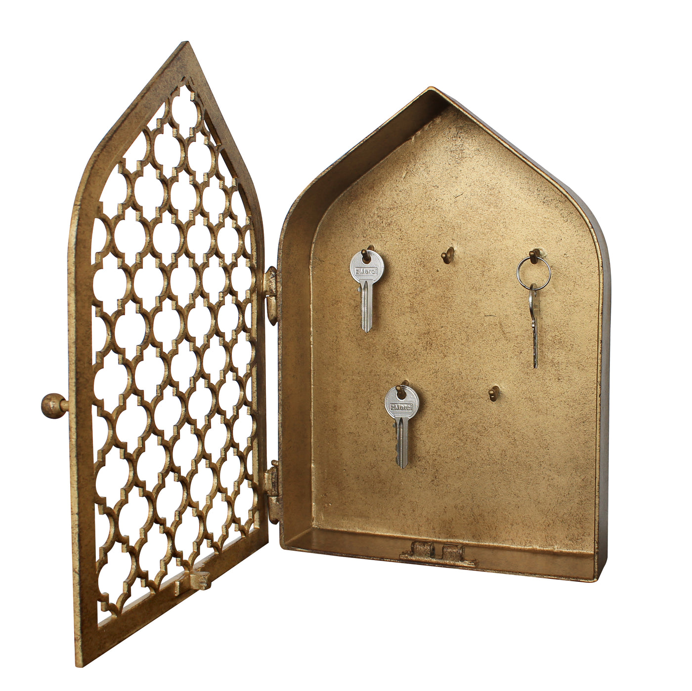 Frontal view of an opened key box with a geometric pattern and pointed arched top painted in an antique gold finish